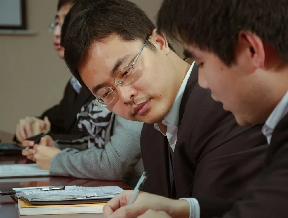 Team reviewing notes in a meeting