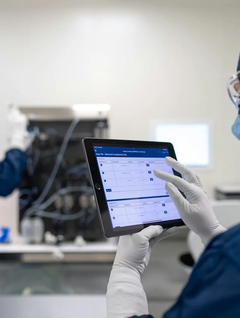 Specialists reviewing data on a tablet