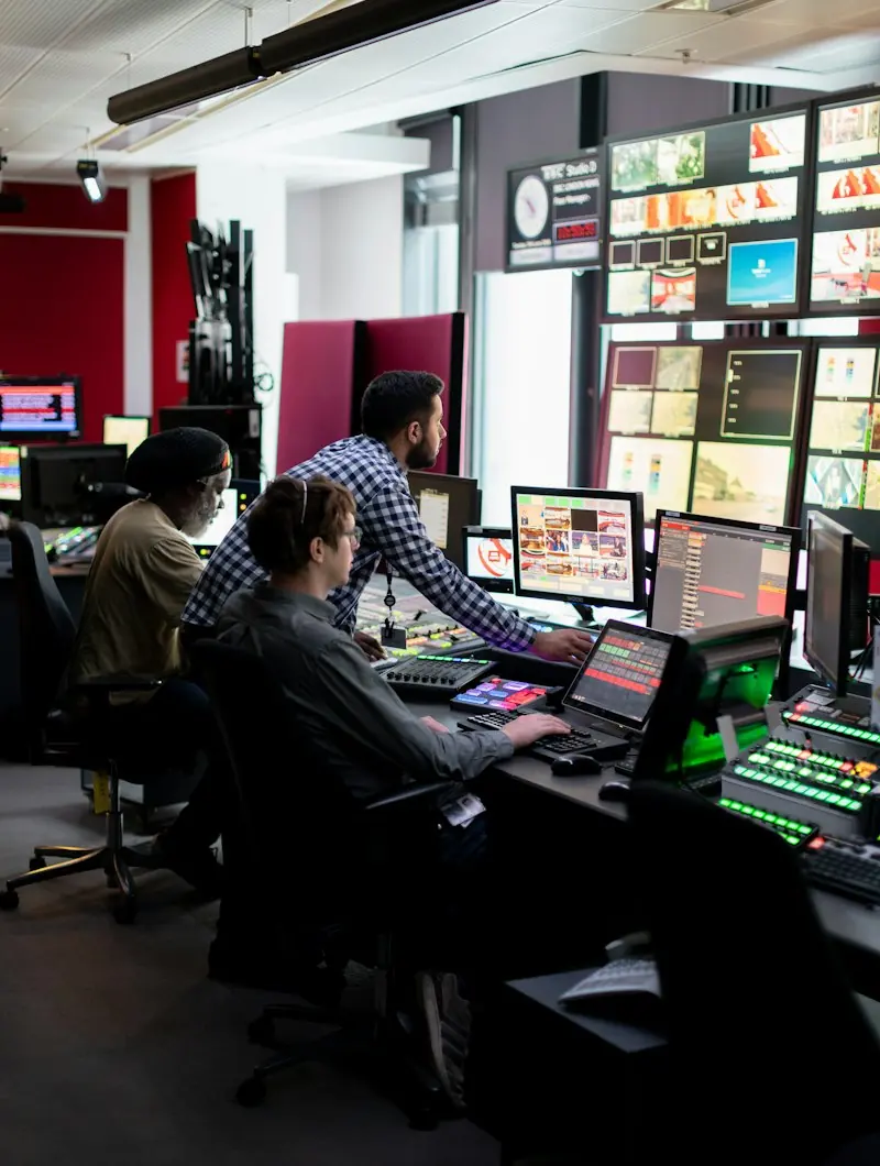 Engineers in a broadcast control room